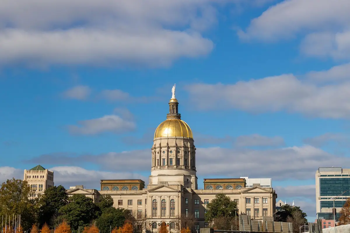 The gold-domed Georgia State Capitol in Atlanta under a blue sky